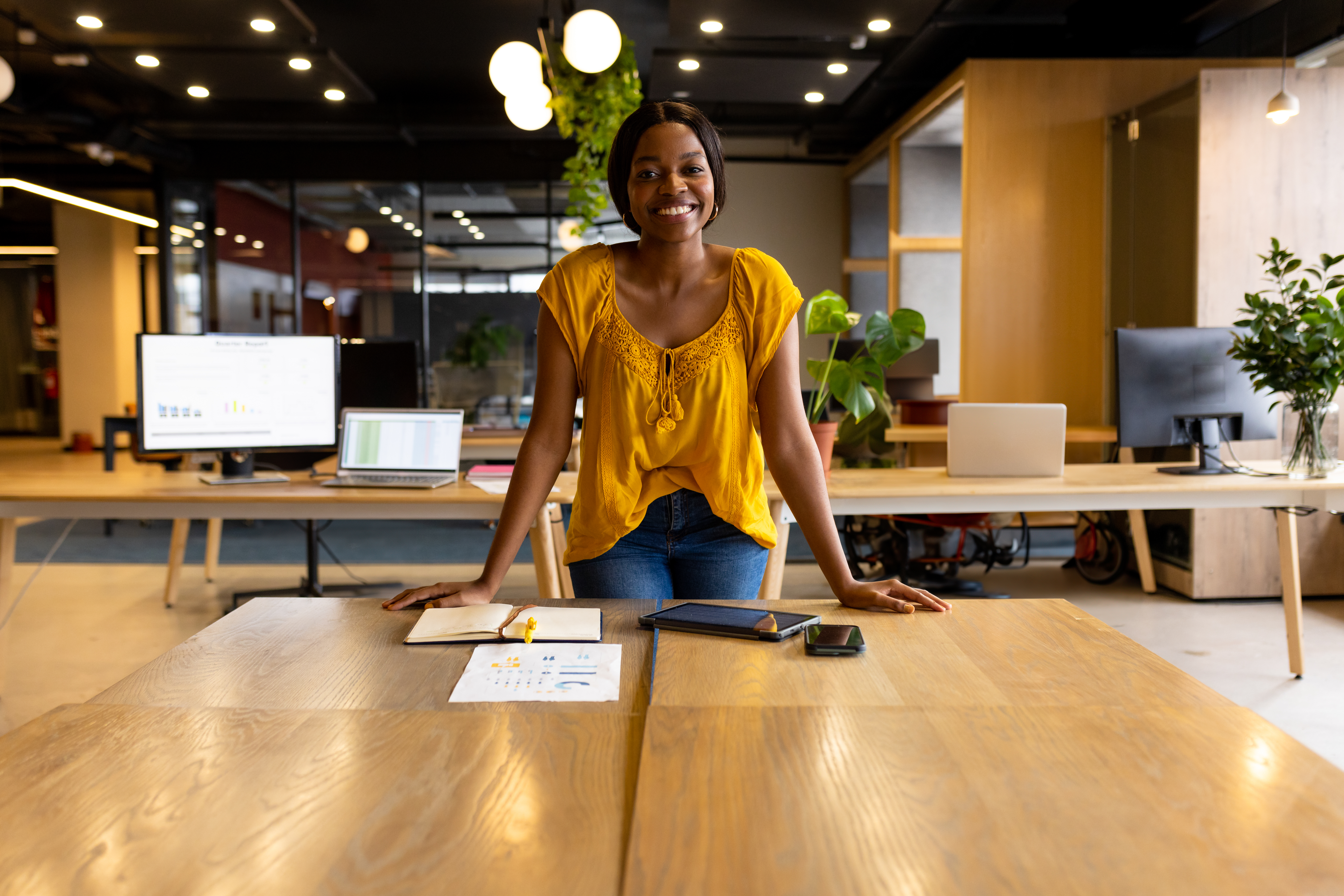 Young professional presenting in a modern workspace