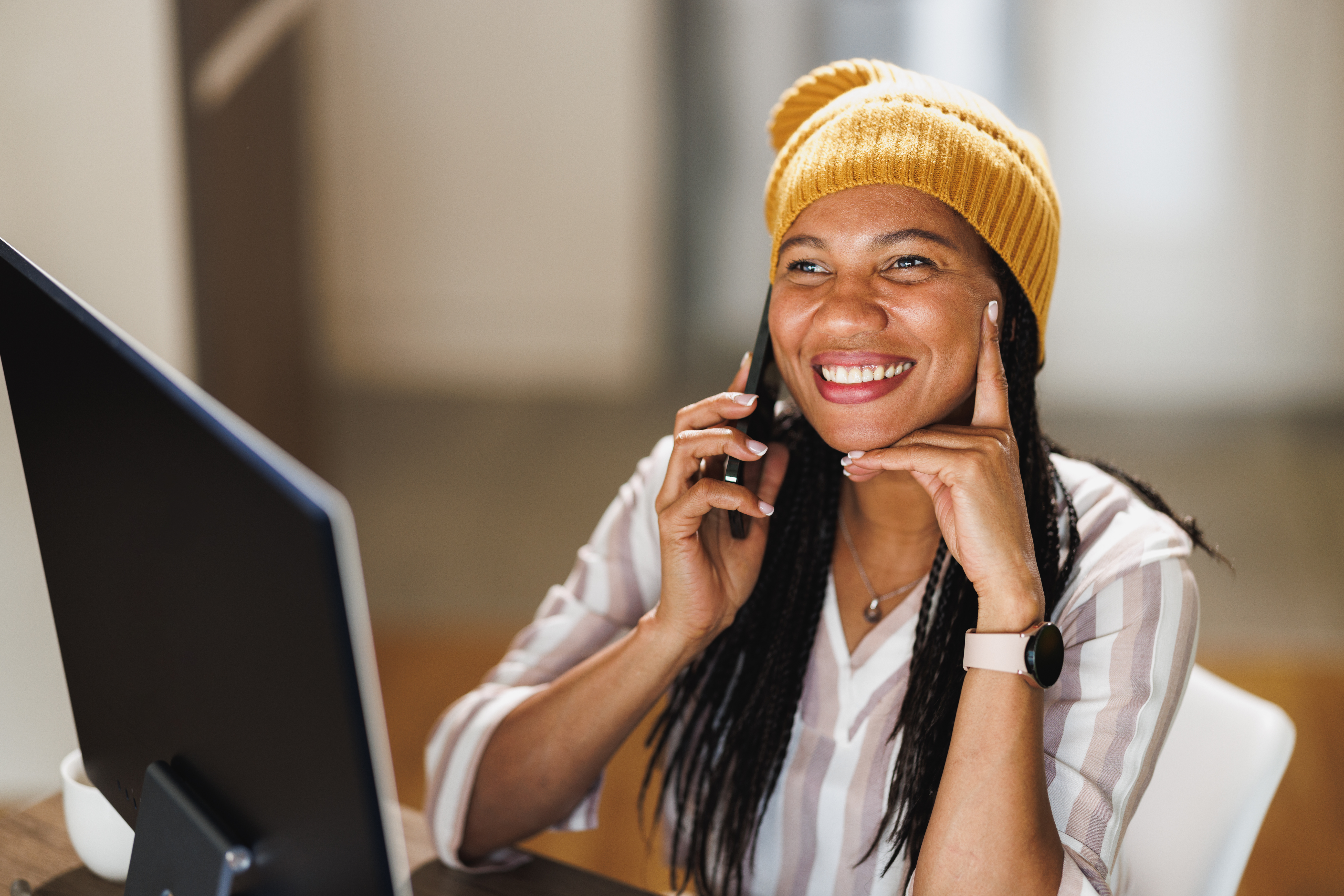 Smiling woman speaking on the phone