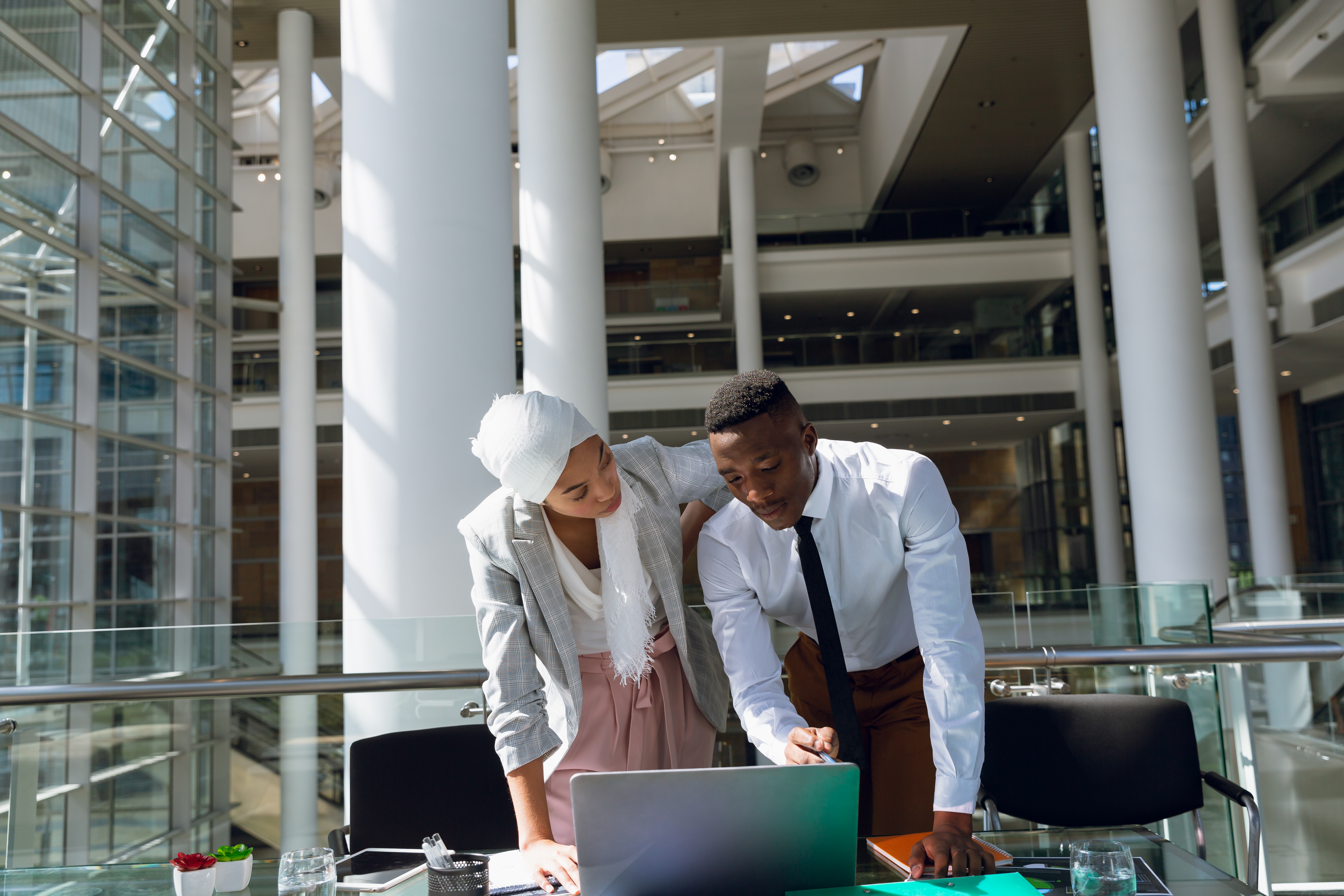 Colleagues working in a bright office building